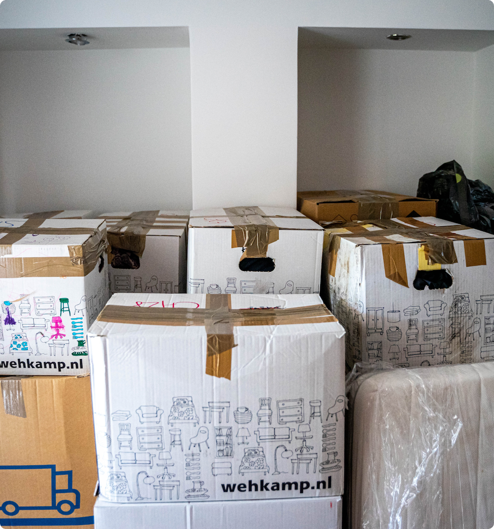 Room full of packed moving boxes.