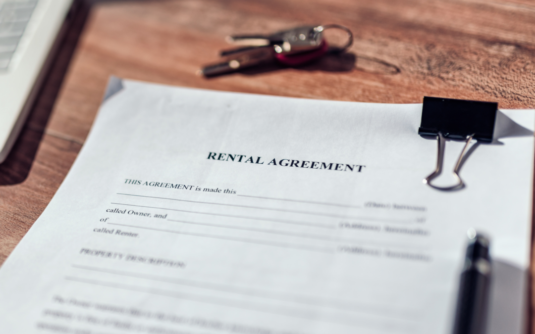 Rental Agreement laying on a desk next to keys