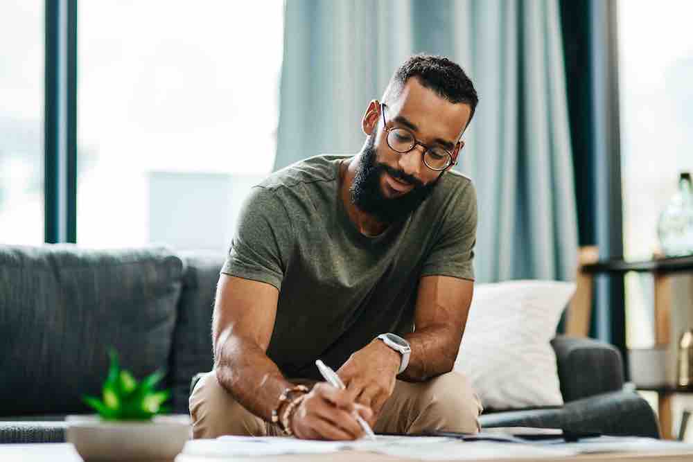 Man going over his finances at home