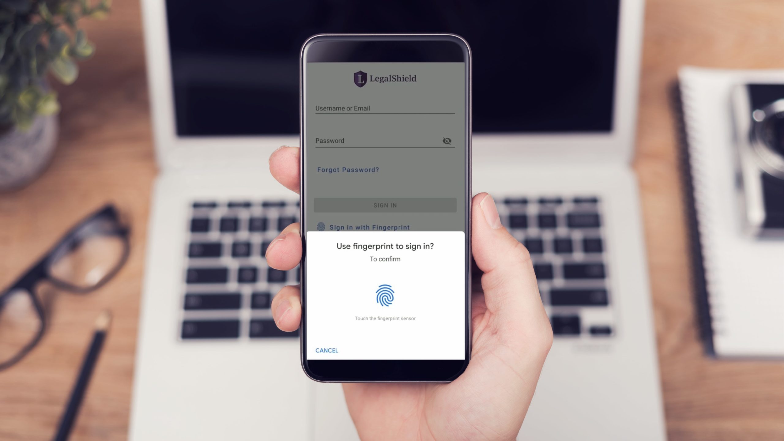 LegalShield mobile app biometric fingerprint login shown on smartphone