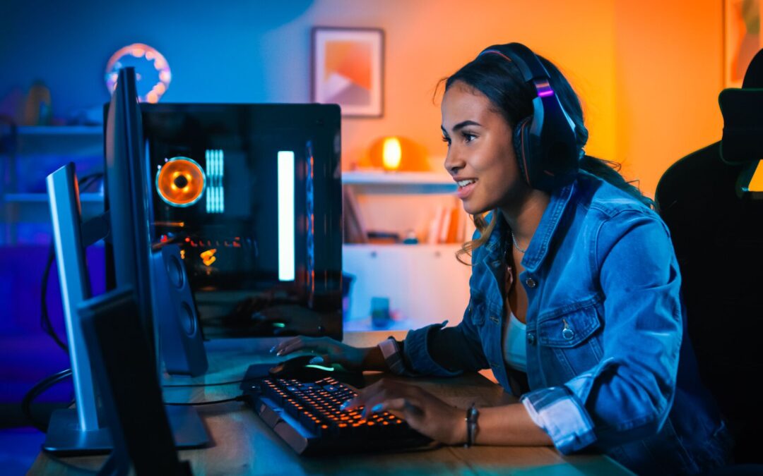Woman playing video games on computer