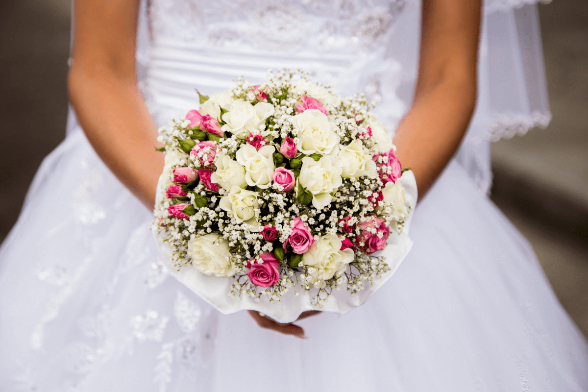Bride holding a bridal bouquet.